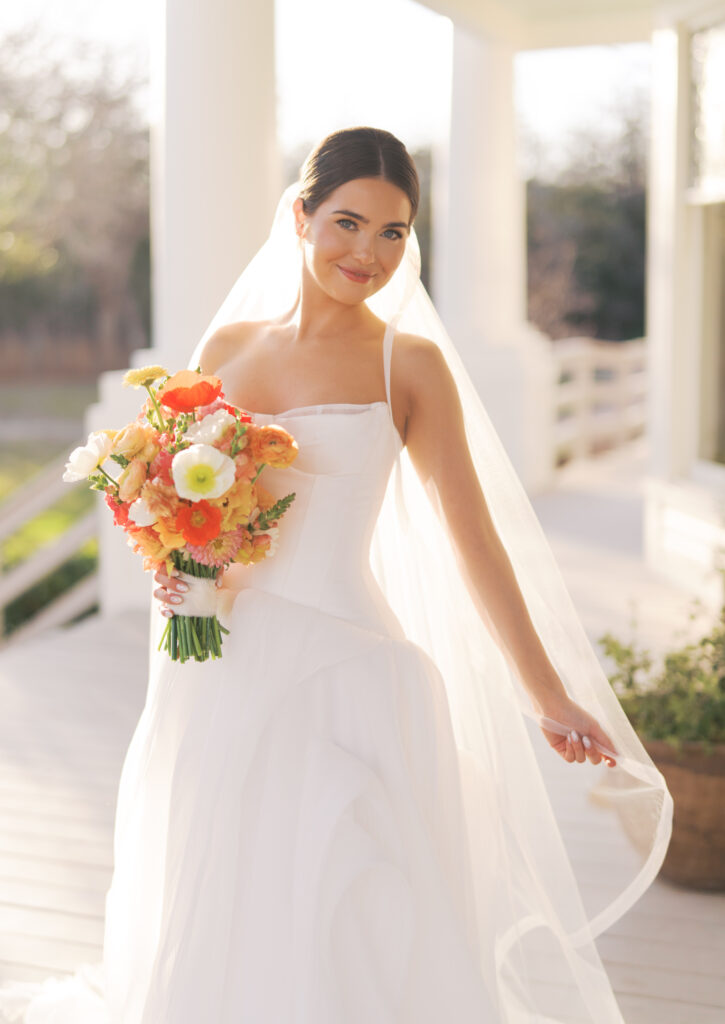 Film bridal portrait of bride walking through flowers at The Grand Lady Austin spring session