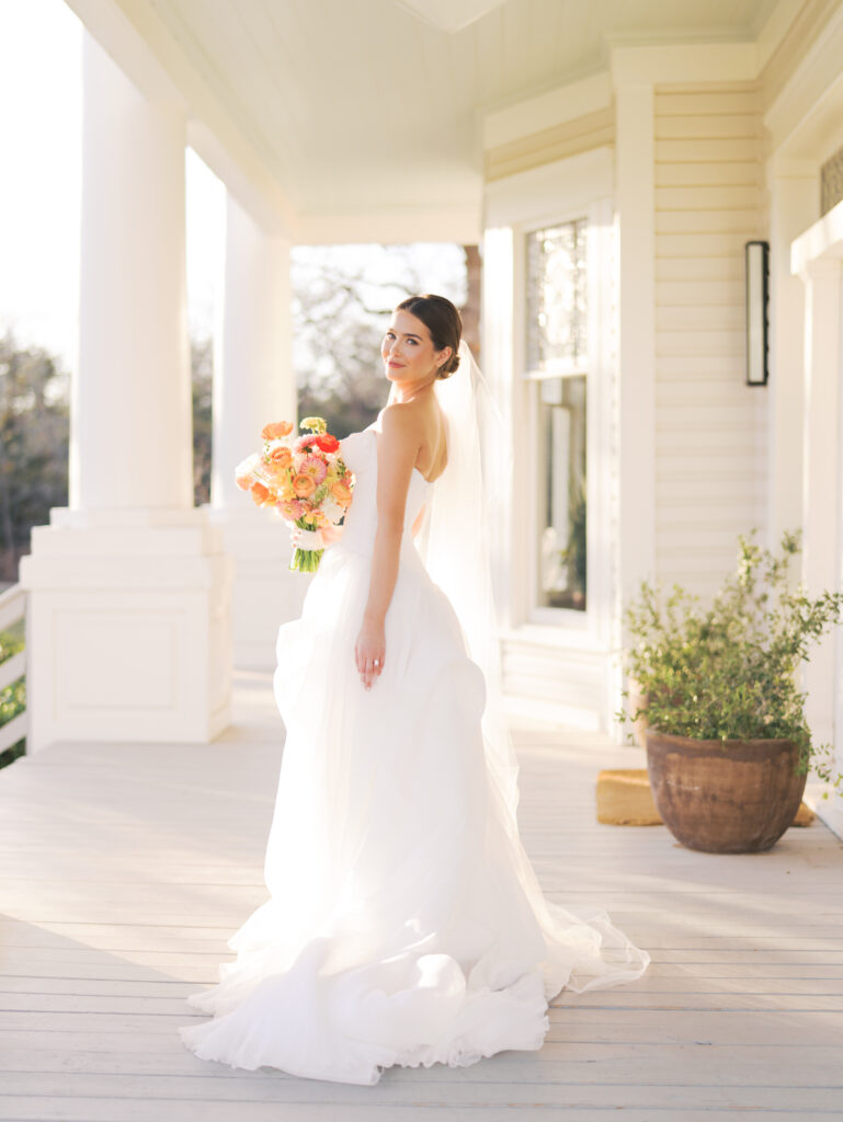Film bridal portrait of bride walking through flowers at The Grand Lady Austin spring session