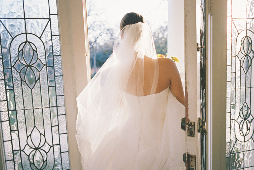 Spring bridal portrait with soft greenery and florals at The Grand Lady Austin