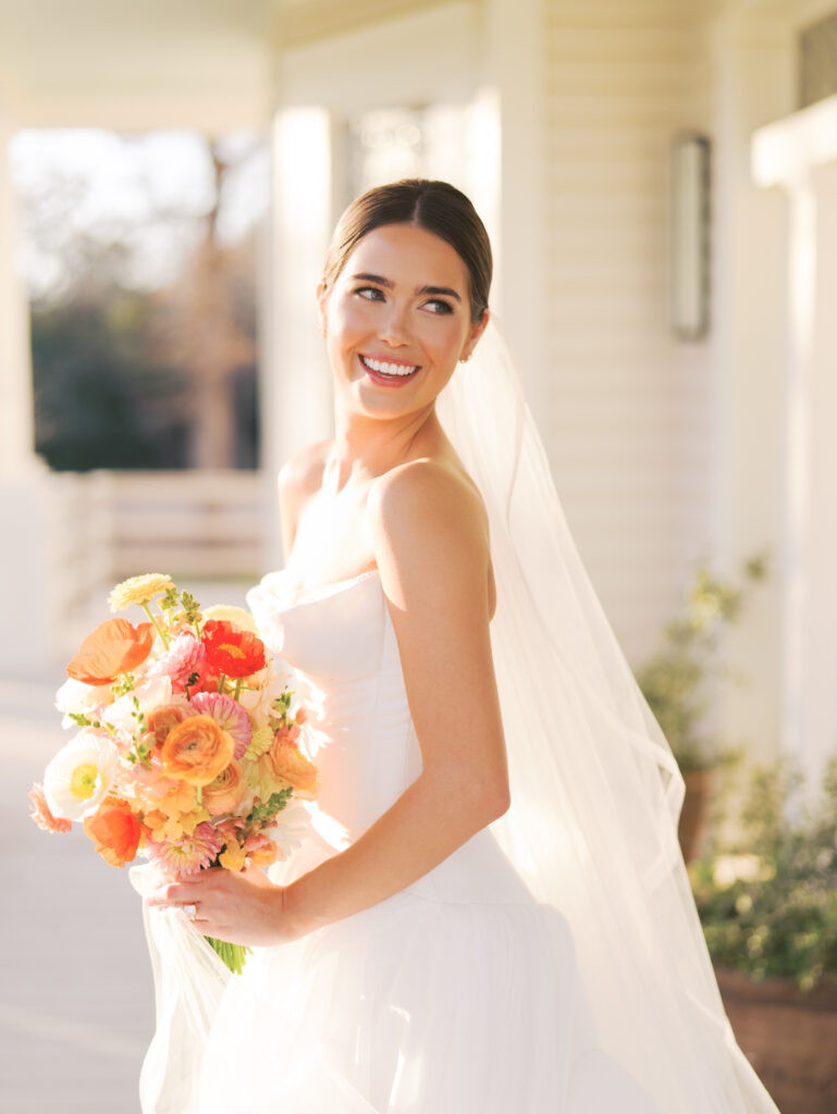 Film bridal portrait of bride walking through flowers at The Grand Lady Austin spring session