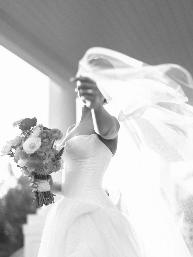 Film bridal portrait of bride walking through flowers at The Grand Lady Austin spring session