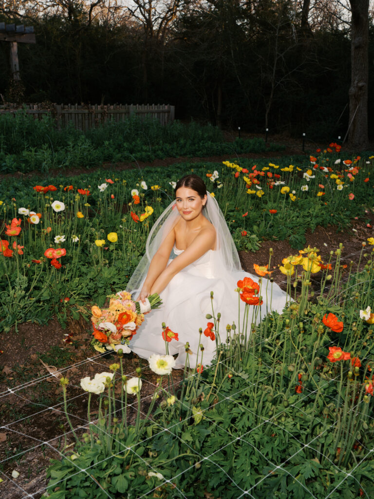 Film bridal portrait of bride walking through flowers at The Grand Lady Austin spring session