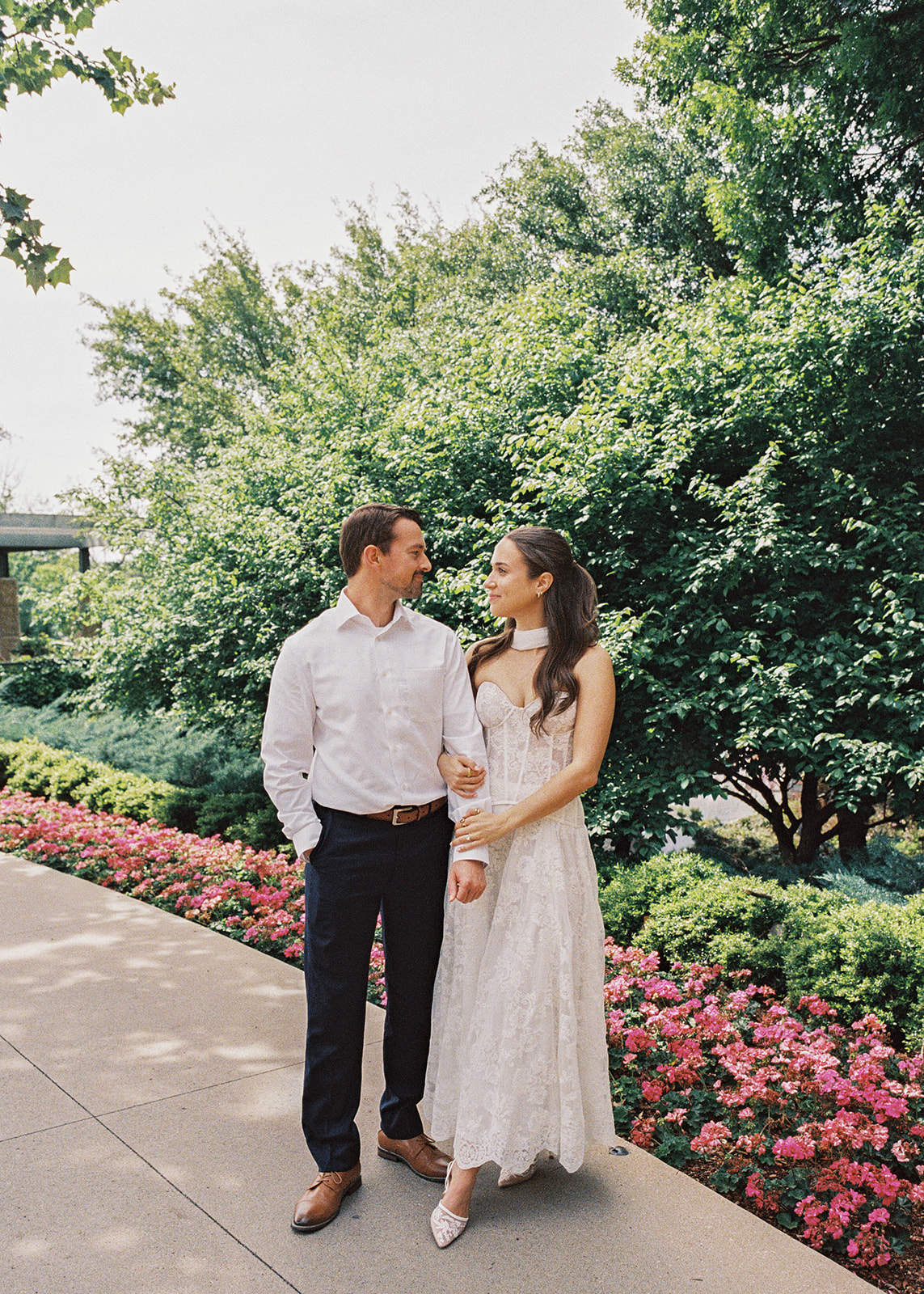 Dallas Arboretum film engagement photos with spring flowers and golden sunshine