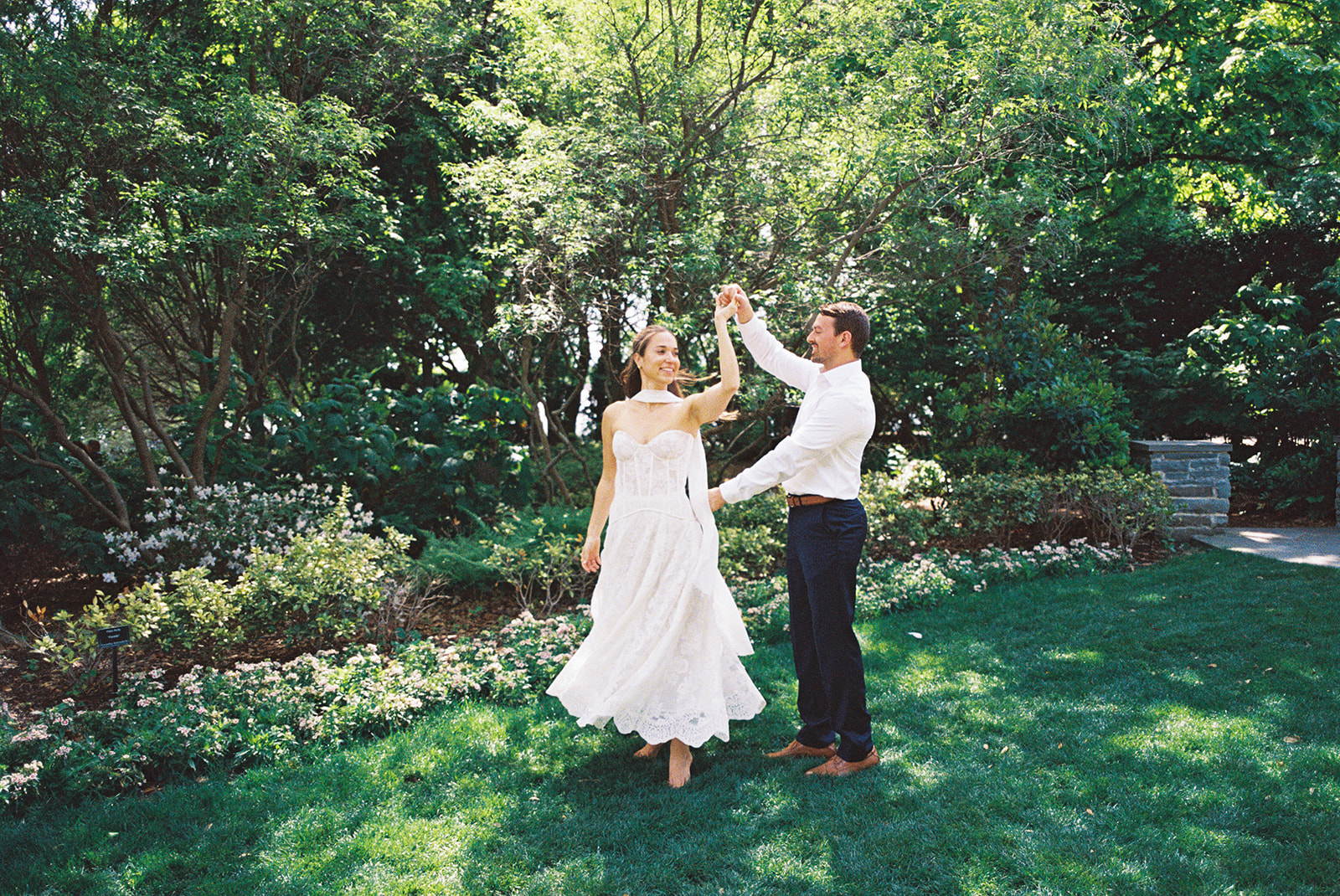 Dallas Arboretum film engagement photos with spring flowers and golden sunshine