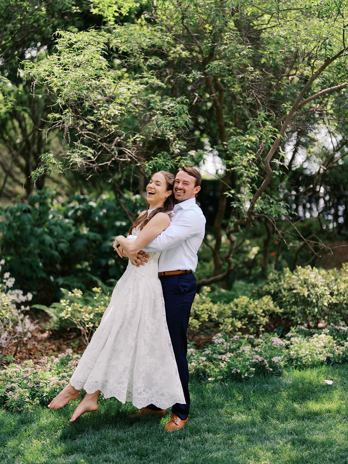 Film engagement portraits at the Dallas Arboretum surrounded by vibrant spring florals