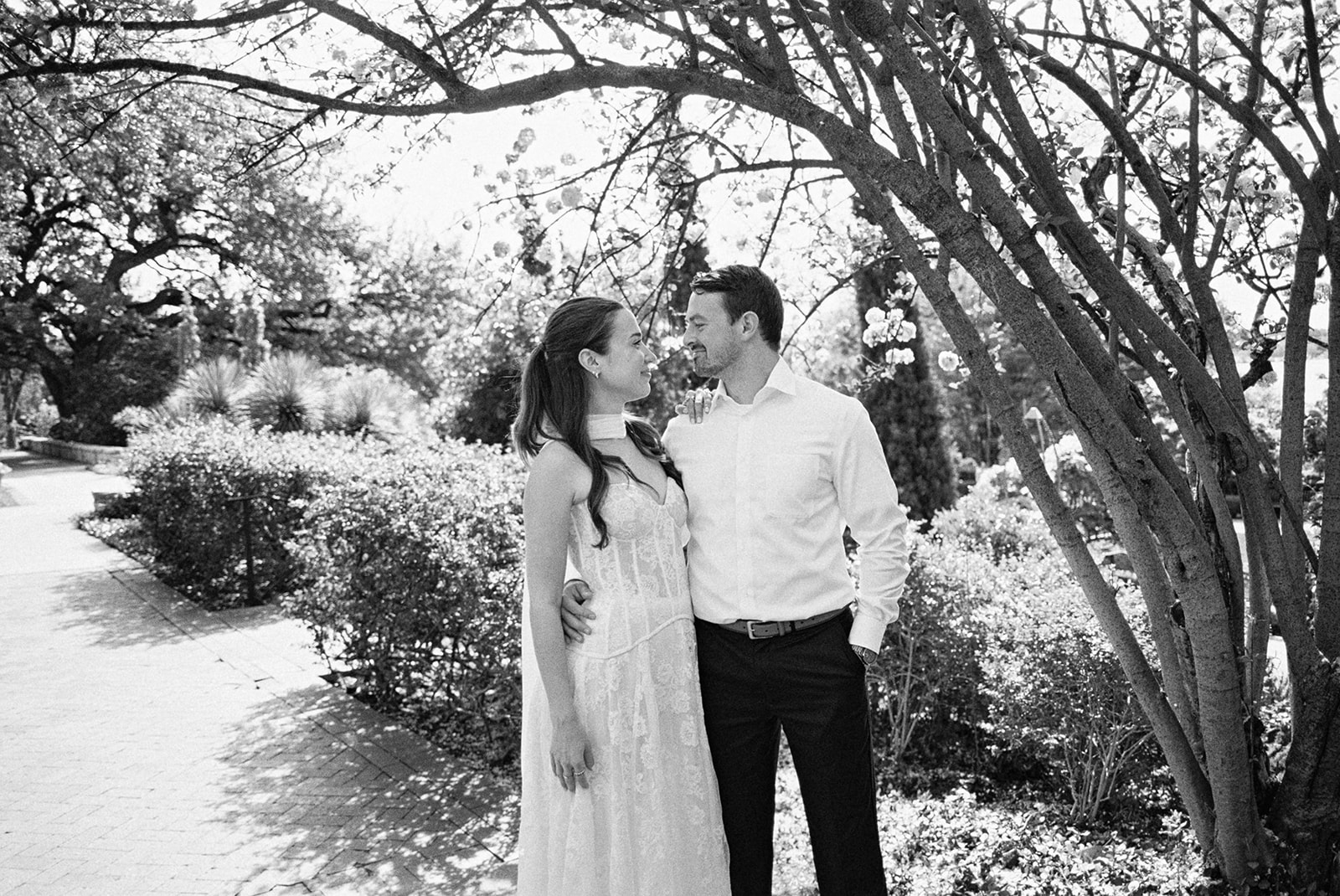 Dallas Arboretum film engagement photos with spring flowers and golden sunshine