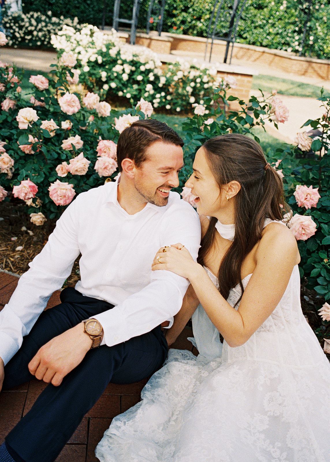 Dallas Arboretum film engagement photos with spring flowers and golden sunshine