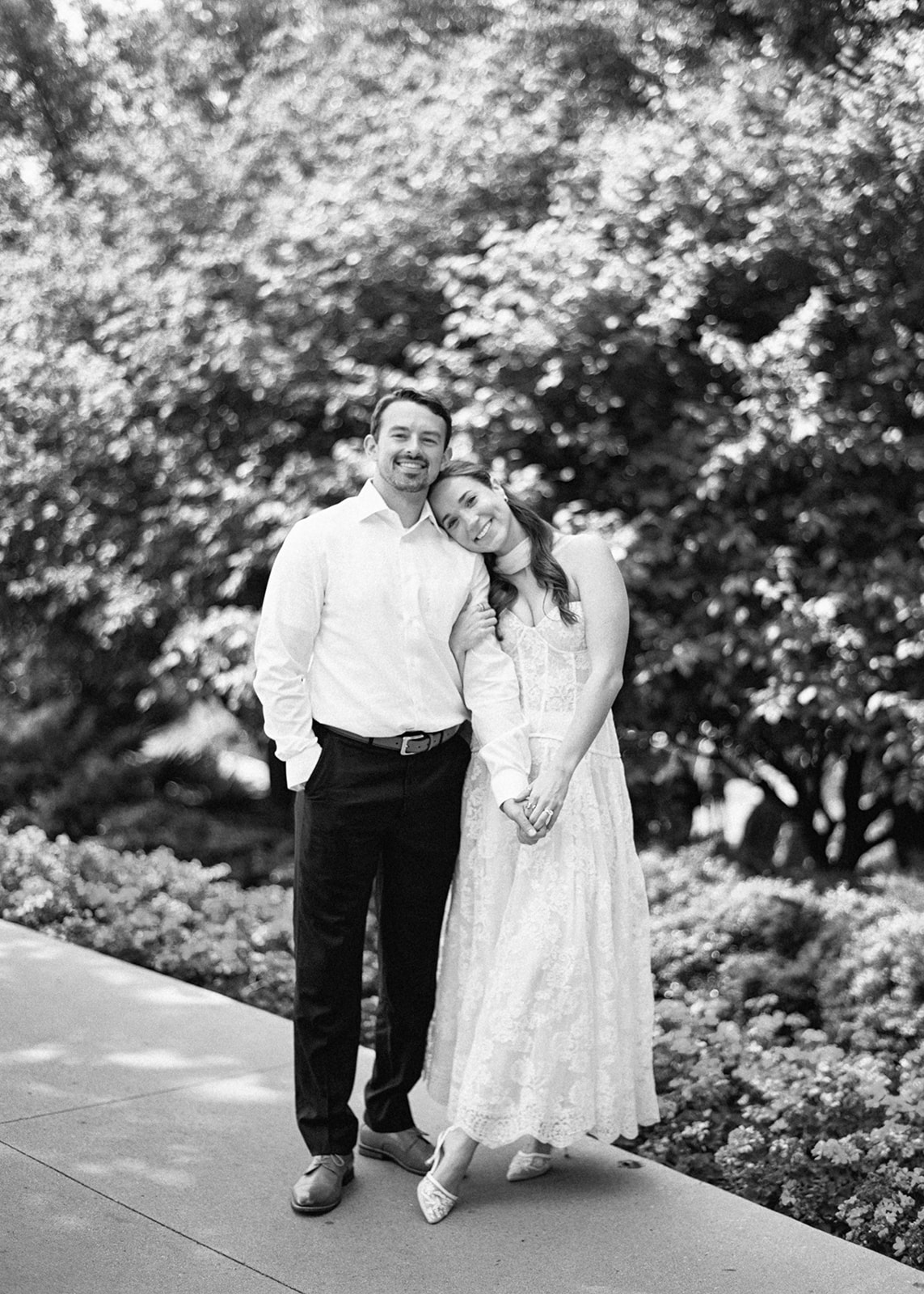 Colorful Dallas Arboretum engagement photos with blooming gardens and sunshine