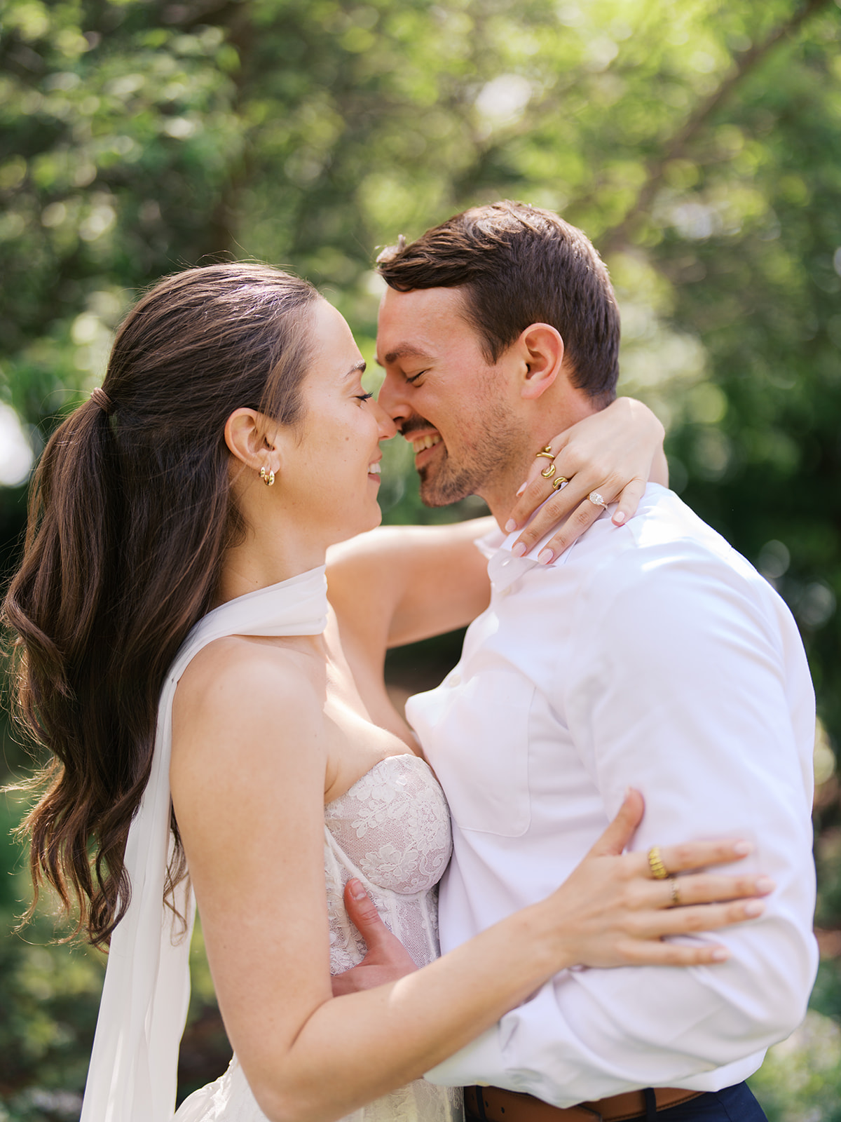 Sunny Dallas Arboretum engagement photos with dreamy film tones and flowers