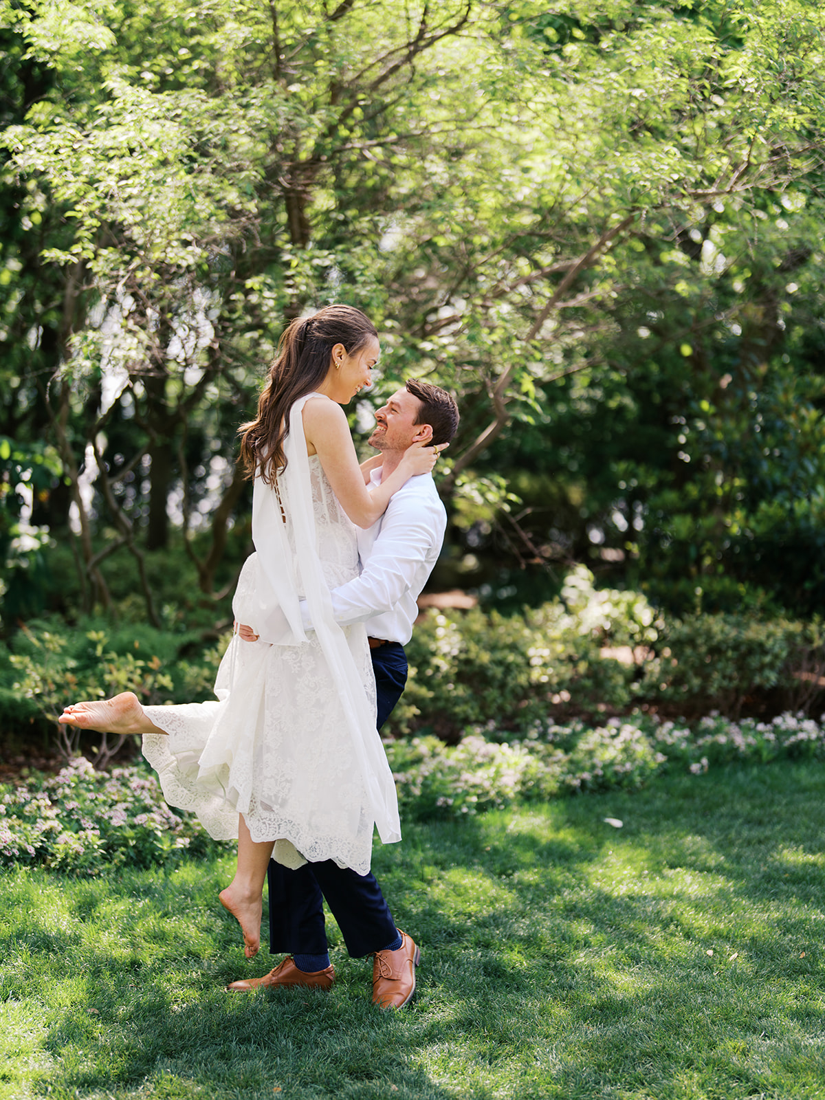 Sunny Dallas Arboretum engagement photos with dreamy film tones and flowers