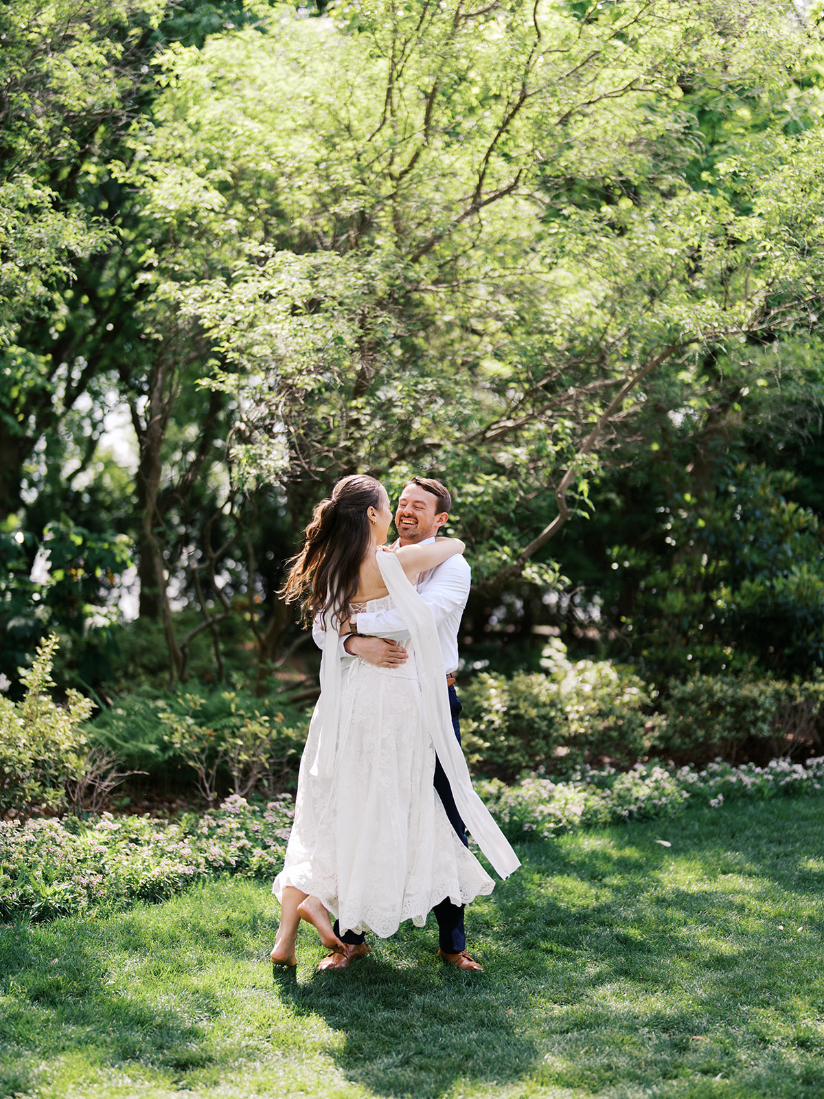 Sunny Dallas Arboretum engagement photos with dreamy film tones and flowers