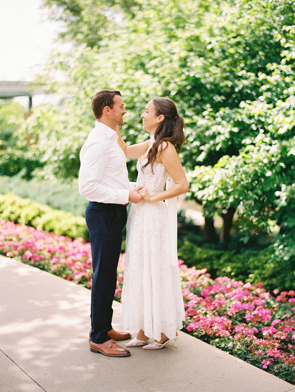 Colorful Dallas Arboretum engagement photos with blooming gardens and sunshine