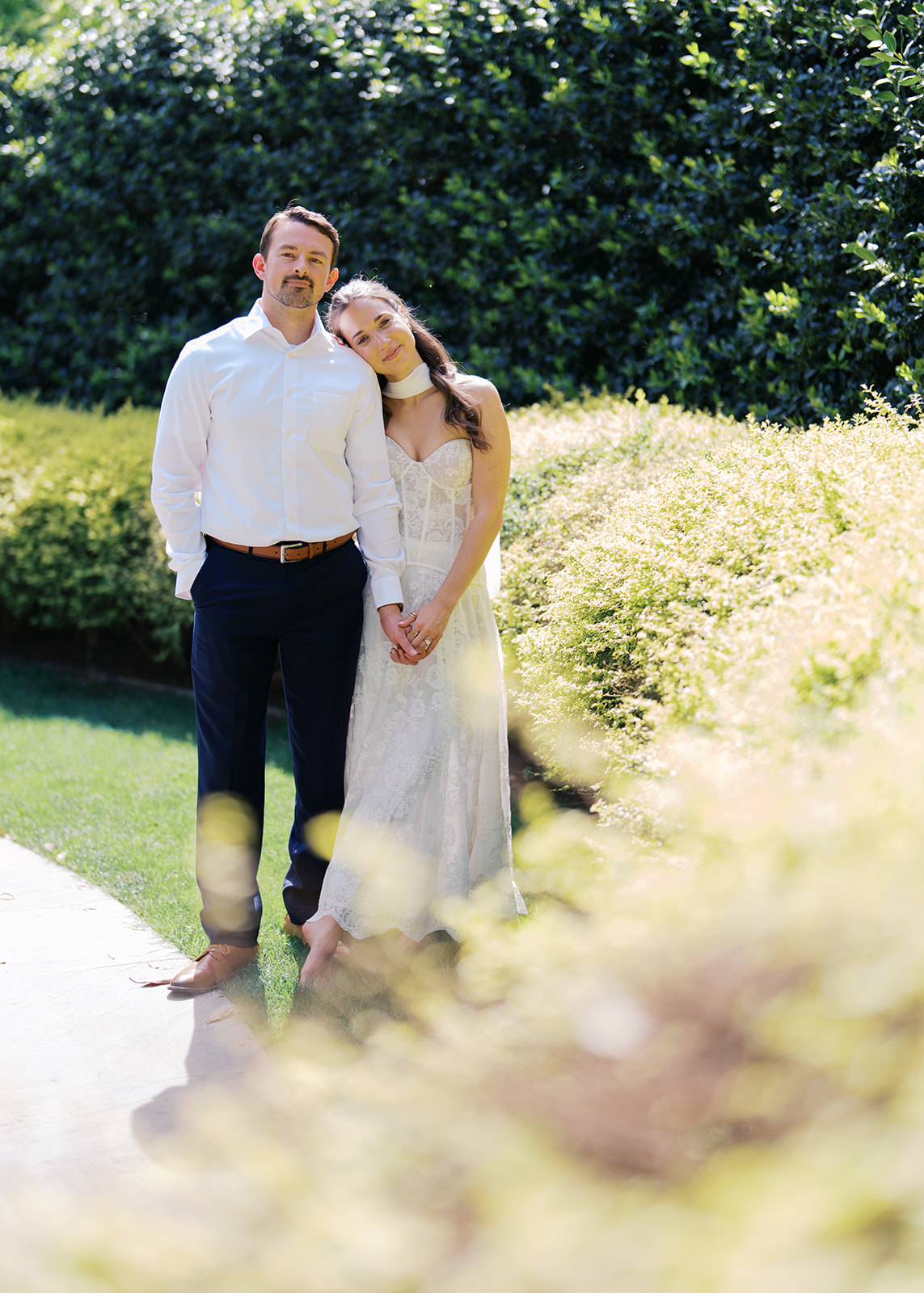 Sunny Dallas Arboretum engagement photos with dreamy film tones and flowers