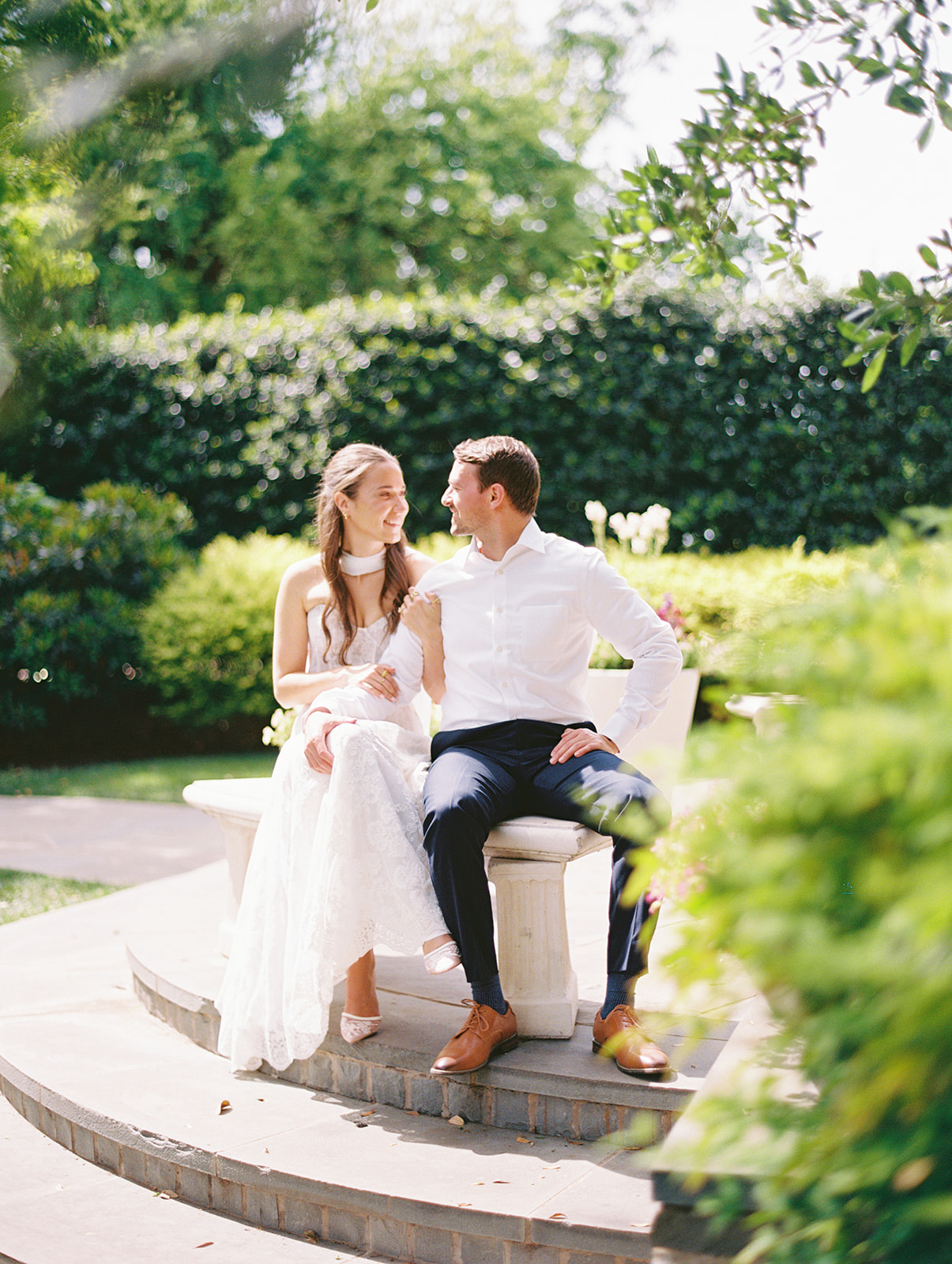 Colorful Dallas Arboretum engagement photos with blooming gardens and sunshine