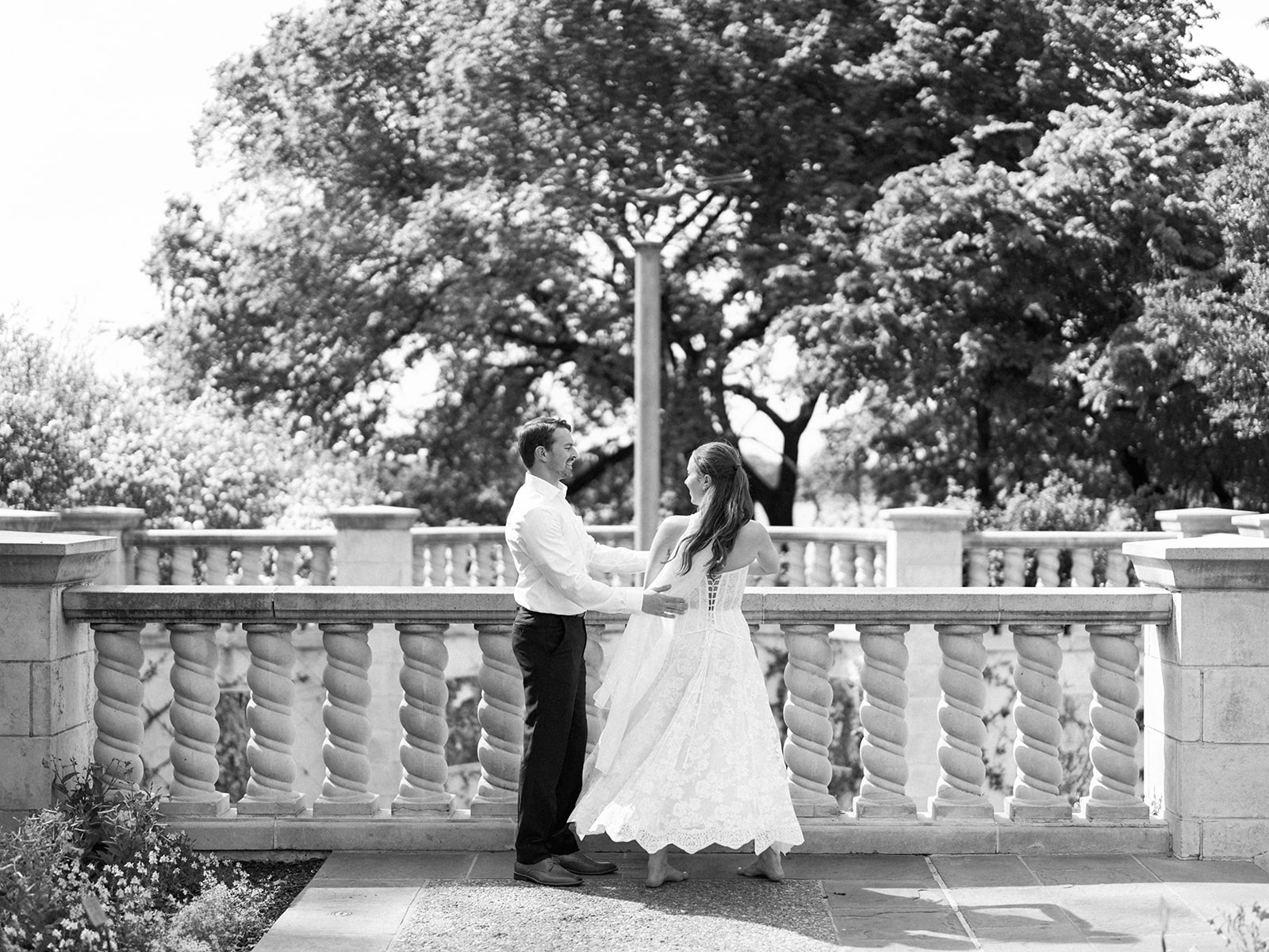 Sunny Dallas Arboretum engagement photos with dreamy film tones and flowers