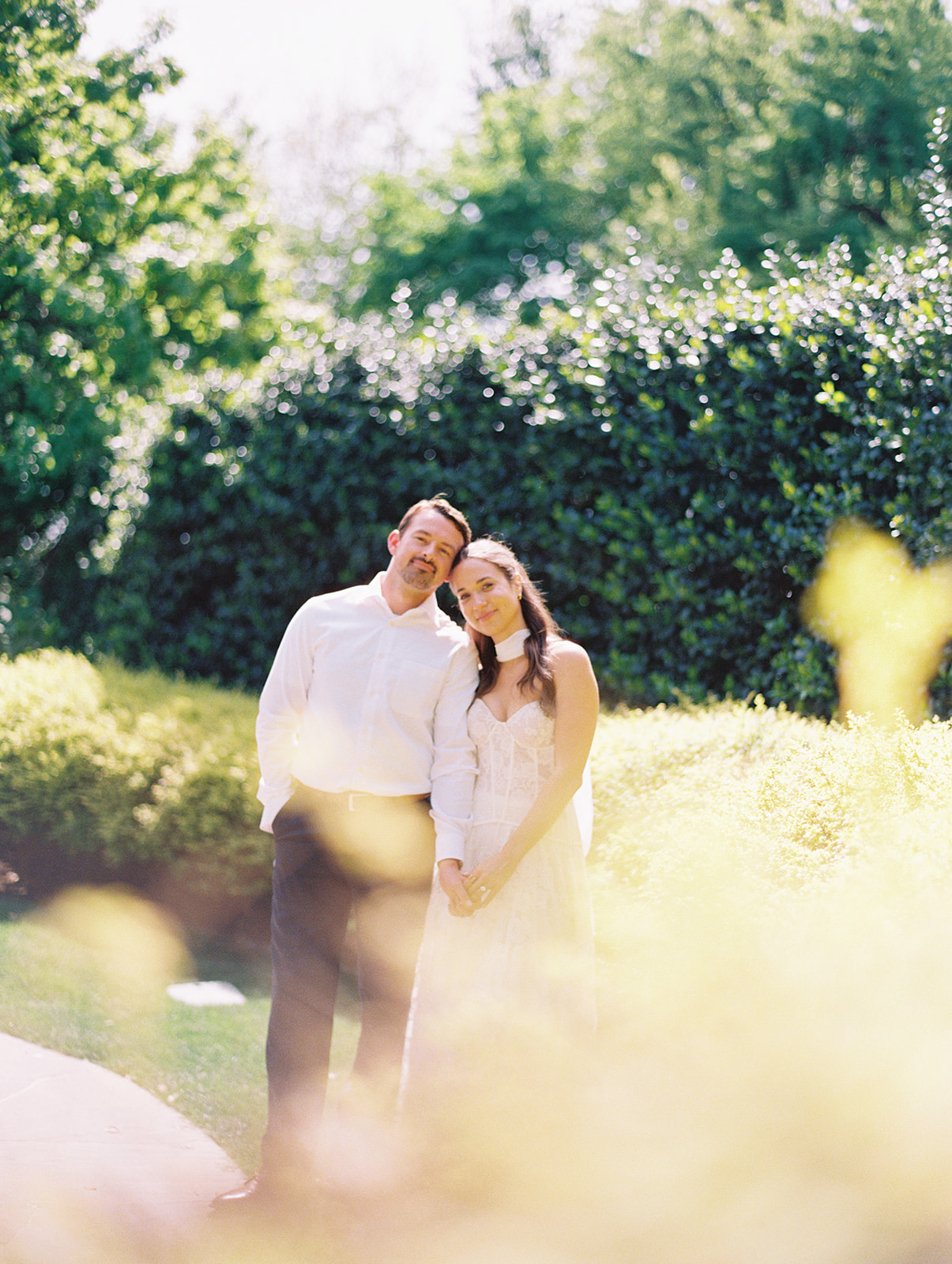 Film engagement portraits at the Dallas Arboretum surrounded by vibrant spring florals