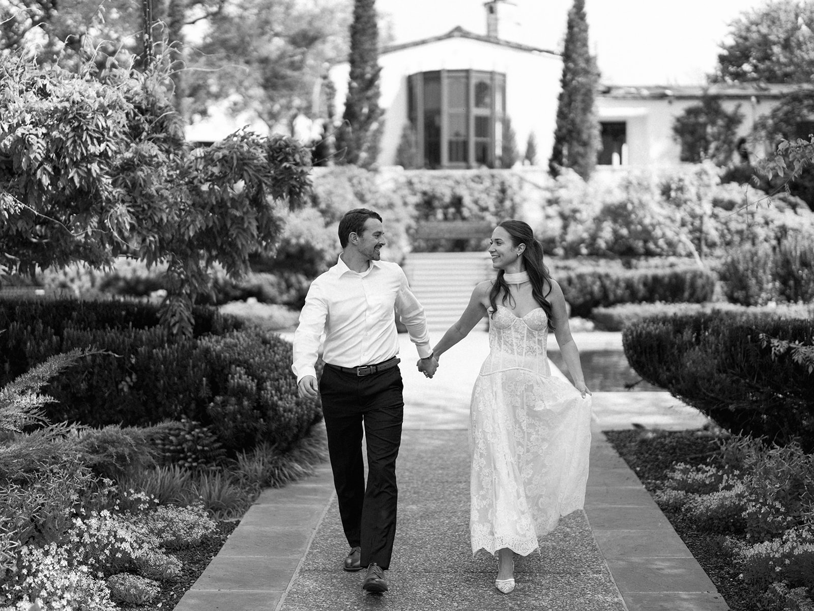 Sunny Dallas Arboretum engagement photos with dreamy film tones and flowers
