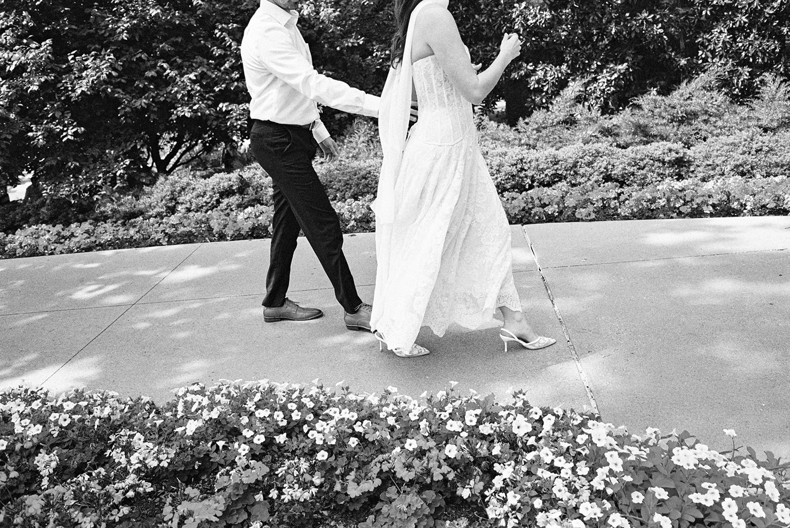 Film engagement portraits at the Dallas Arboretum surrounded by vibrant spring florals