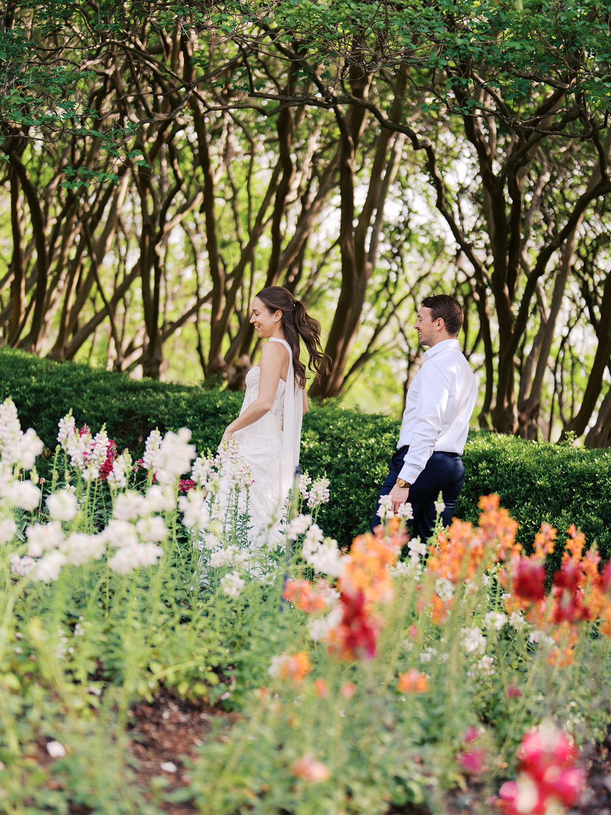 Sunny Dallas Arboretum engagement photos with dreamy film tones and flowers