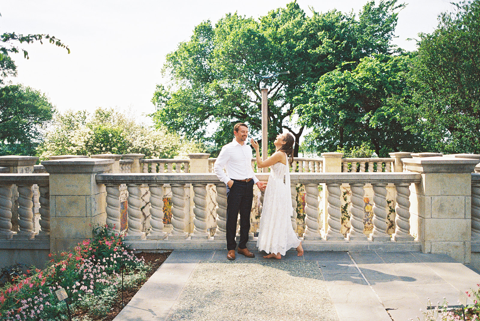 Film engagement portraits at the Dallas Arboretum surrounded by vibrant spring florals