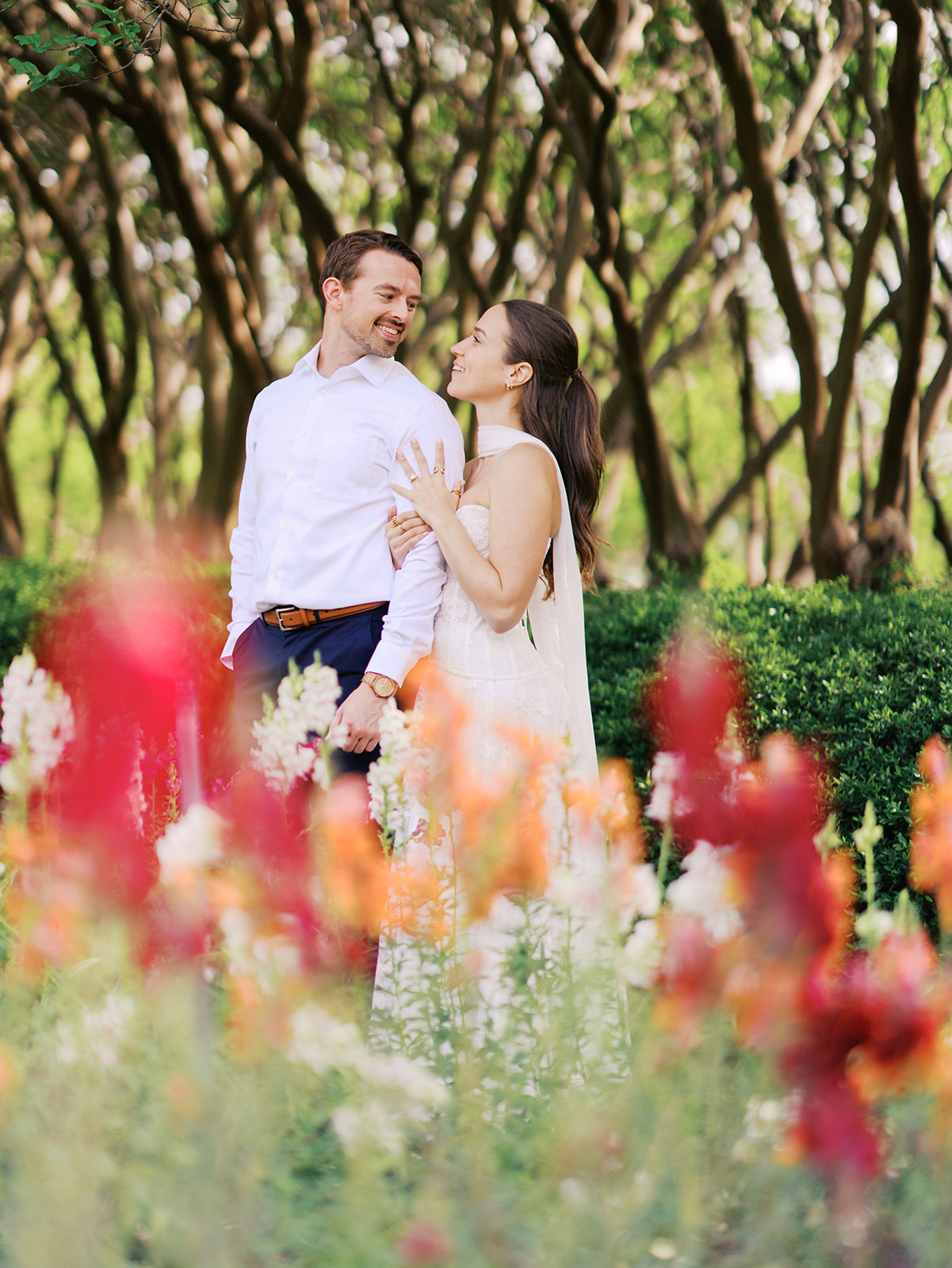 Sunny Dallas Arboretum engagement photos with dreamy film tones and flowers