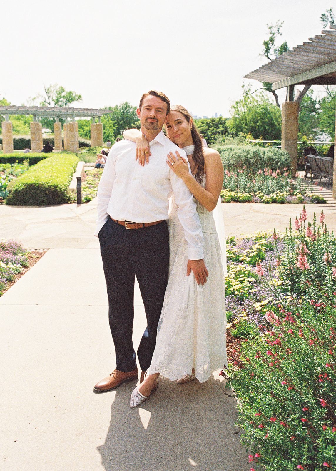 Dallas Arboretum film engagement photos with spring flowers and golden sunshine