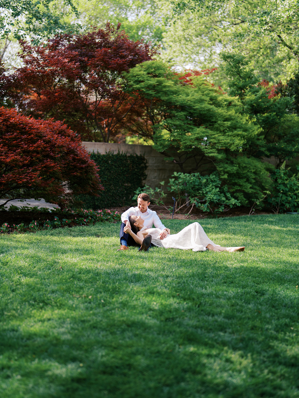 Sunny Dallas Arboretum engagement photos with dreamy film tones and flowers