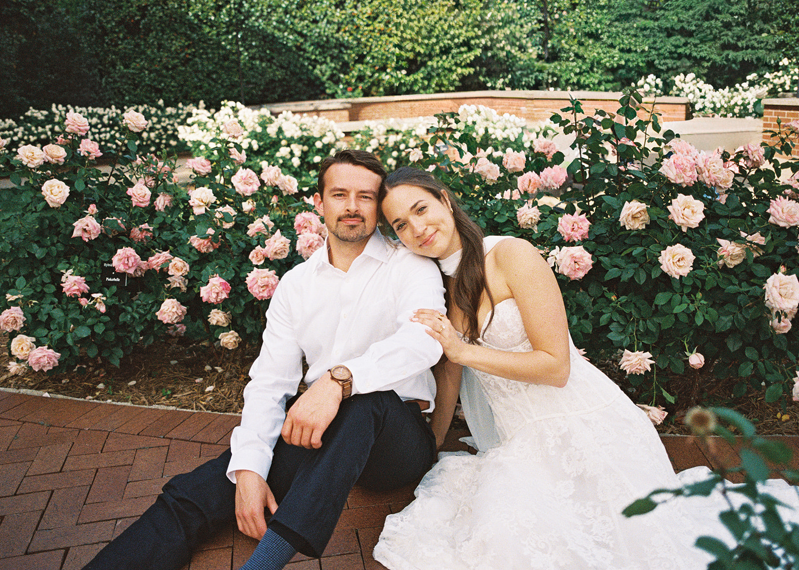 Film engagement portraits at the Dallas Arboretum surrounded by vibrant spring florals