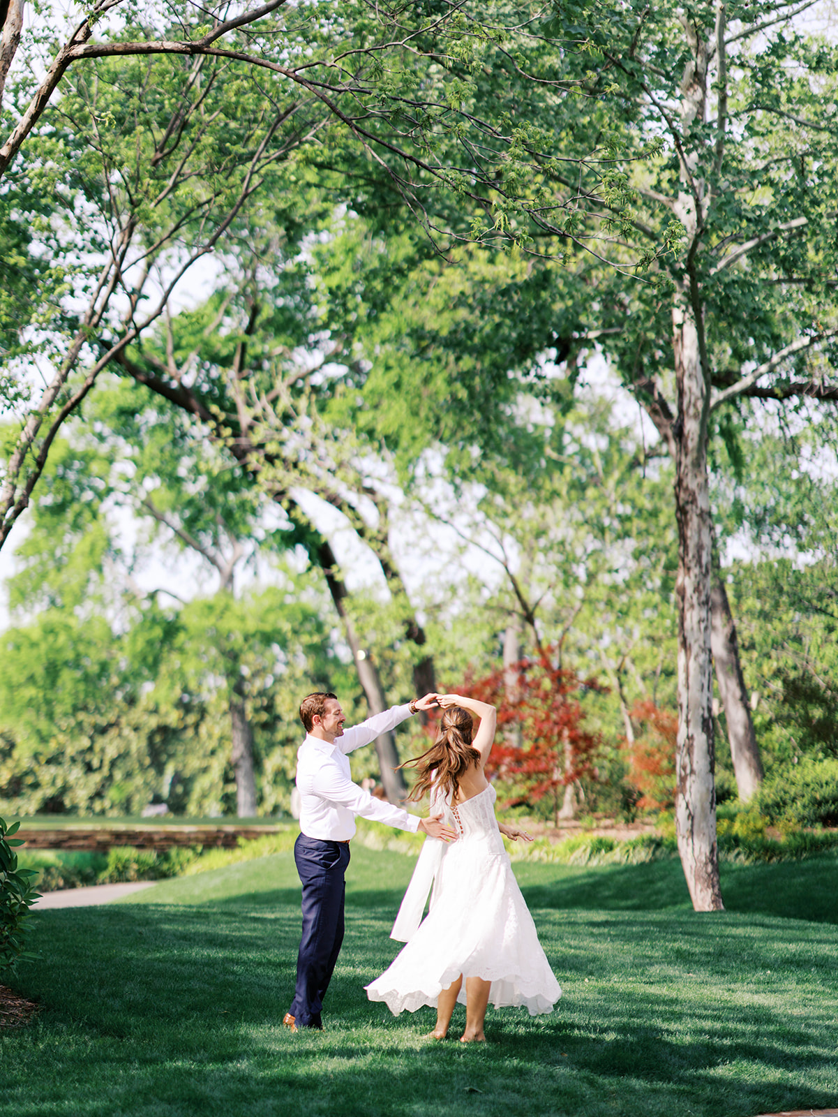 Dallas Arboretum film engagement photos with spring flowers and golden sunshine