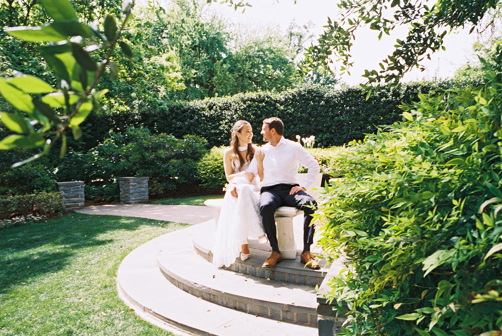 Dallas Arboretum film engagement photos with spring flowers and golden sunshine