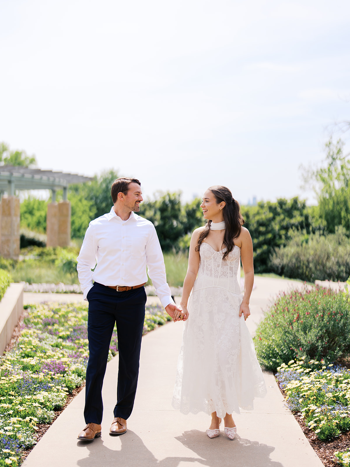 Film engagement portraits at the Dallas Arboretum surrounded by vibrant spring florals