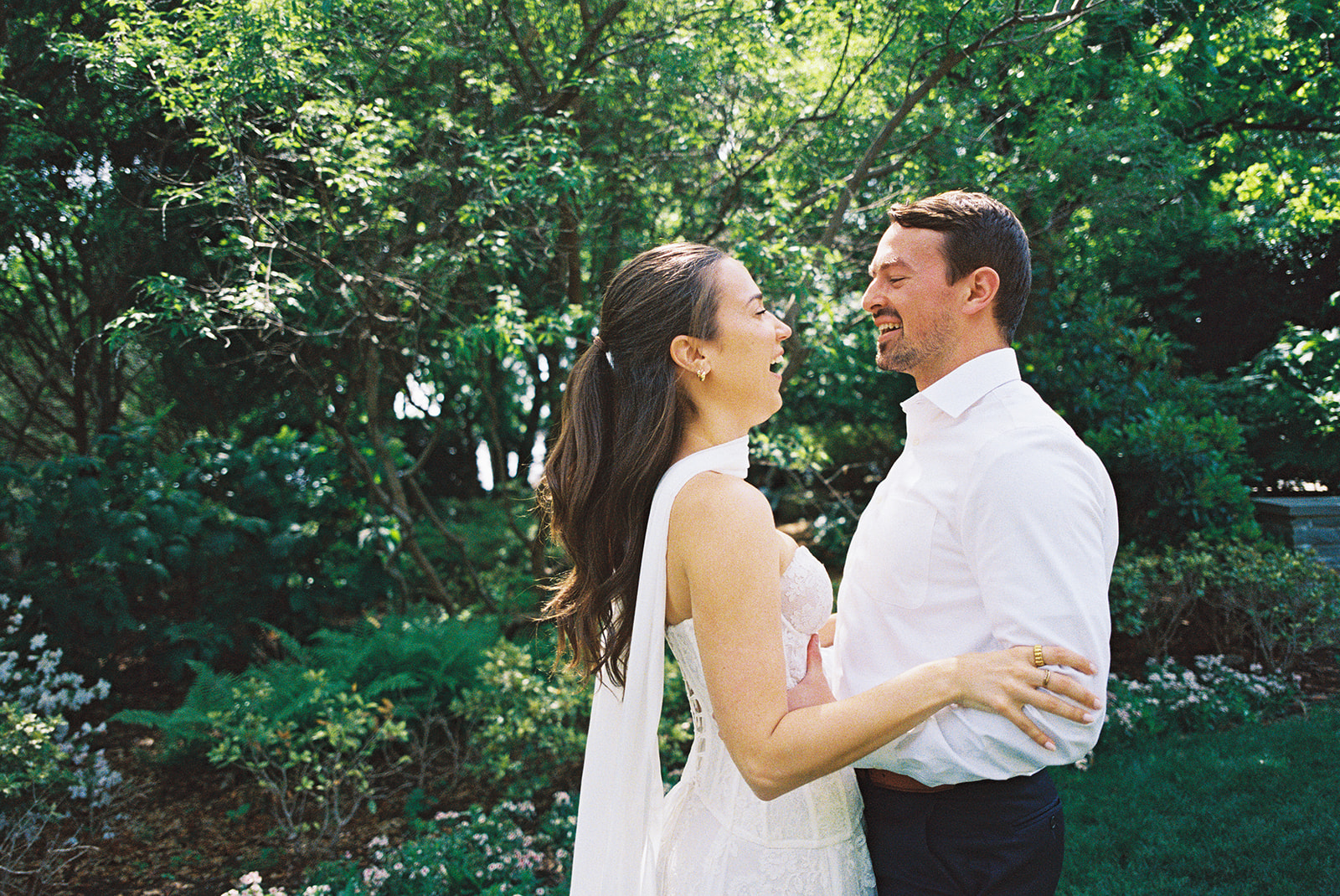 Dallas Arboretum film engagement photos with spring flowers and golden sunshine