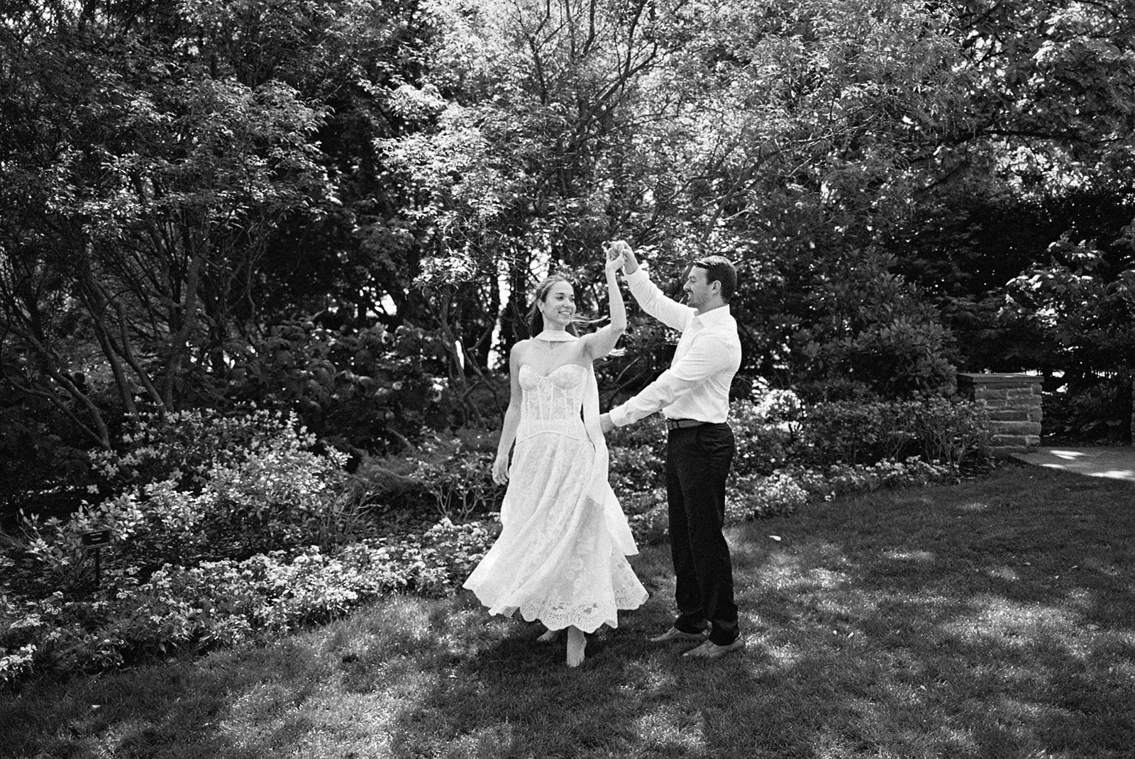 Dallas Arboretum film engagement photos with spring flowers and golden sunshine