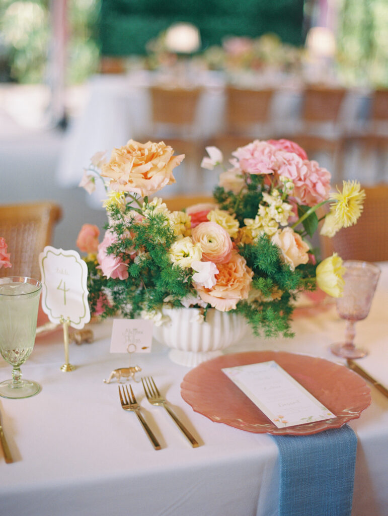Joyful Fort Worth Zoo wedding with colorful flowers and glowing light