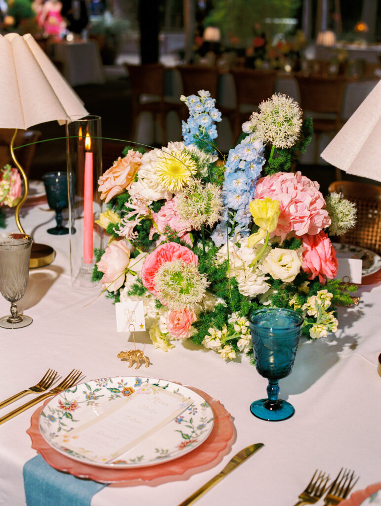Joyful Fort Worth Zoo wedding with colorful flowers and glowing light