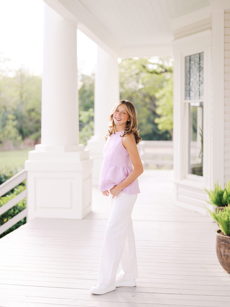 Film senior session with soft sunshine and white architecture at The Grand Lady