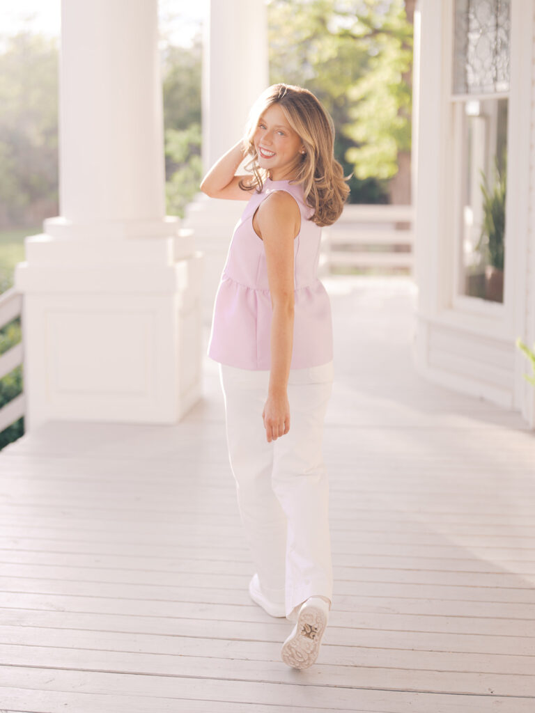 Film senior session with soft sunshine and white architecture at The Grand Lady