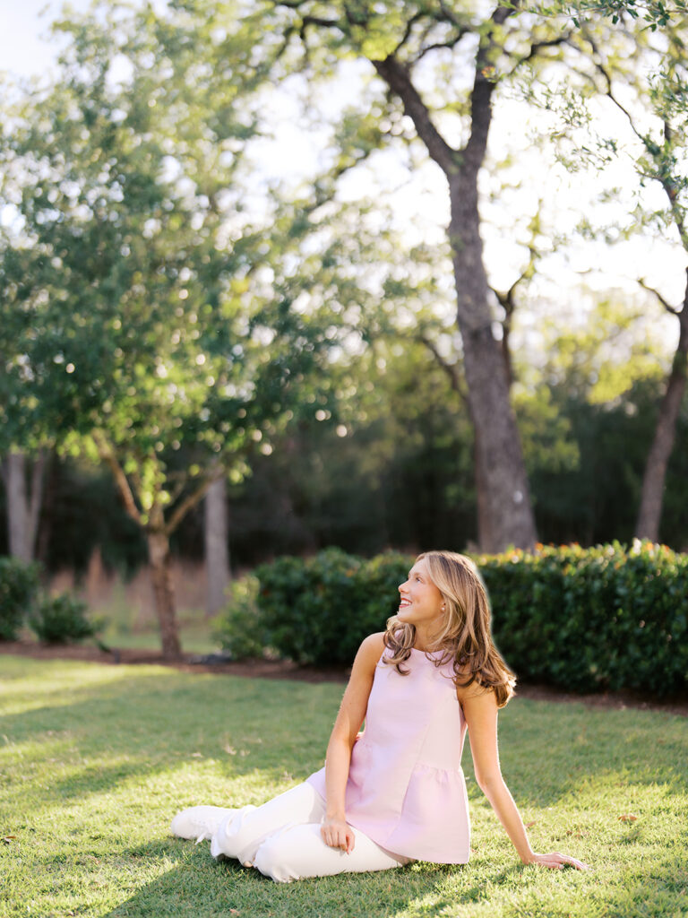 Film senior session with soft sunshine and white architecture at The Grand Lady