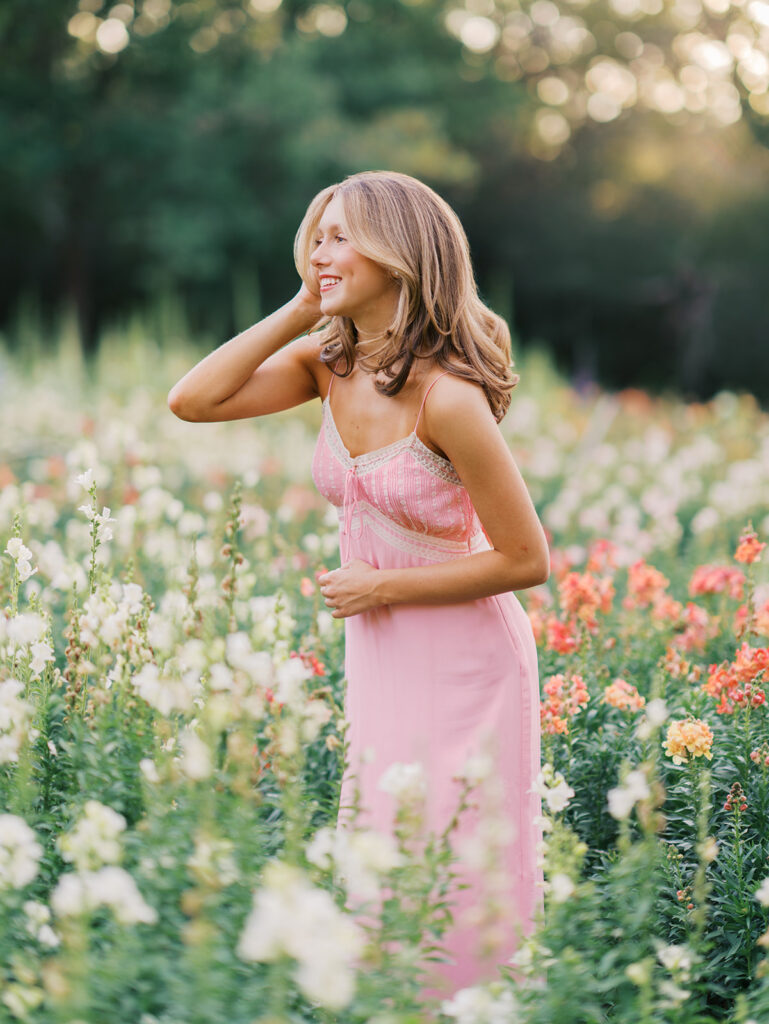 Film senior session with soft sunshine and white architecture at The Grand Lady