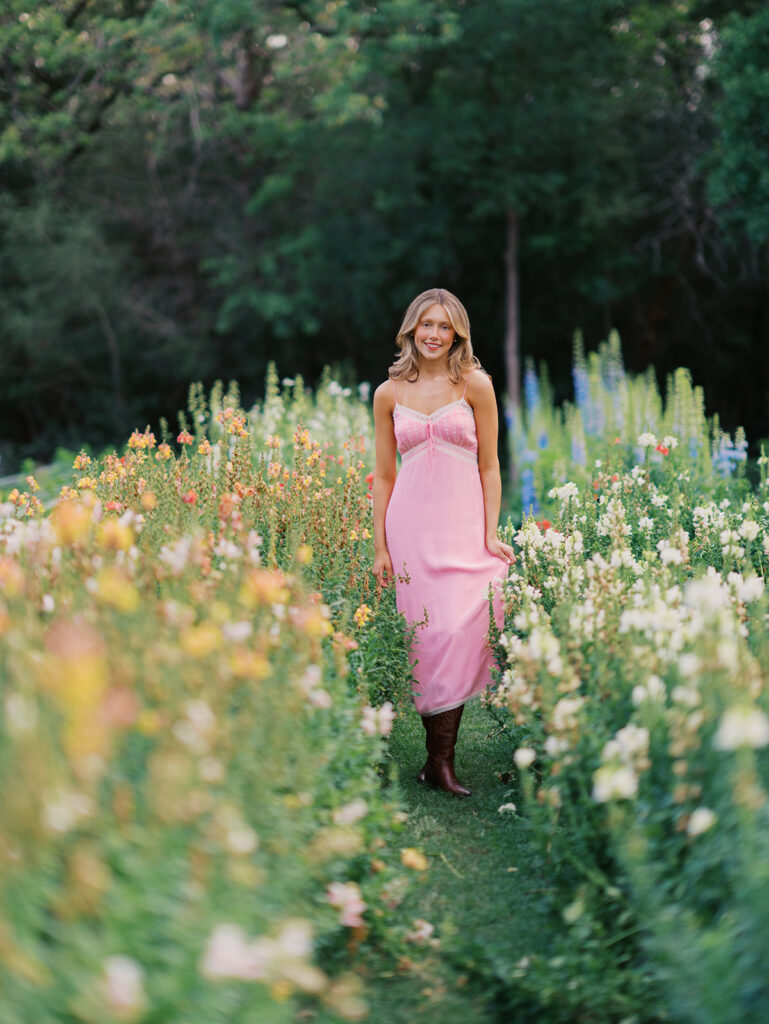 Film senior session with soft sunshine and white architecture at The Grand Lady