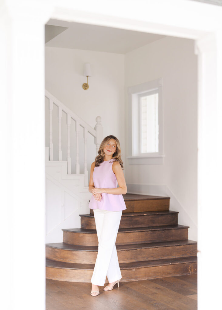 Film senior session with soft sunshine and white architecture at The Grand Lady