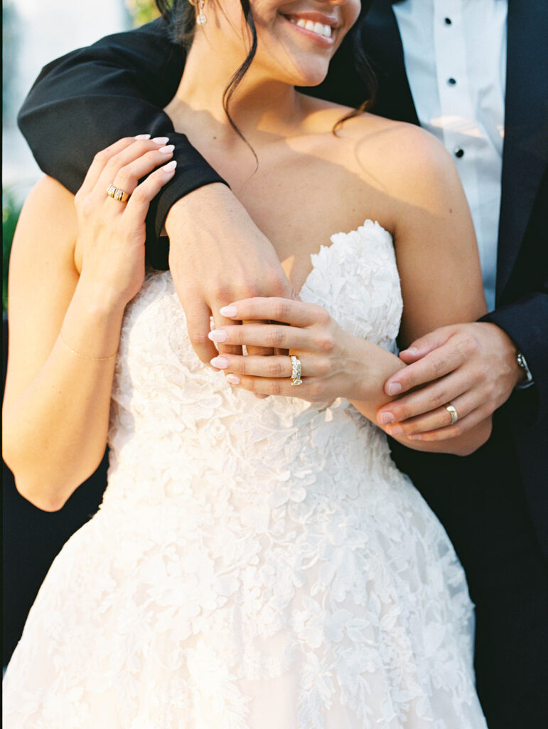 Bride and groom sharing romantic wedding portraits at Horseshoe Bay Resort surrounded by sunshine and stunning Lake LBJ scenery.