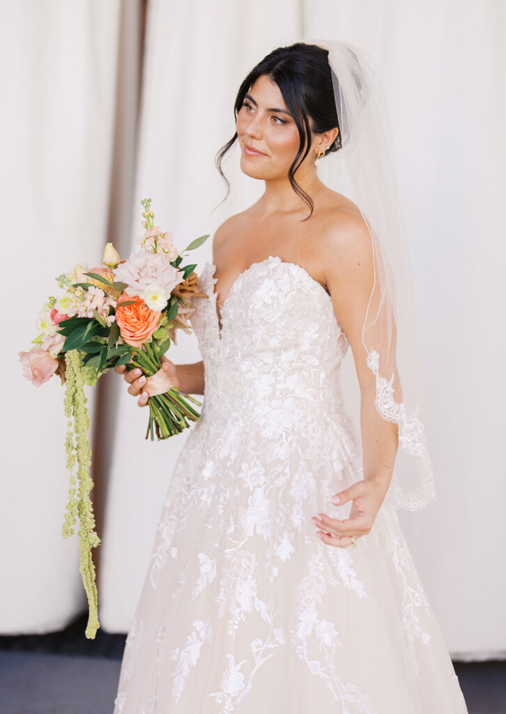 Bride and groom sharing romantic wedding portraits at Horseshoe Bay Resort surrounded by sunshine and stunning Lake LBJ scenery.
