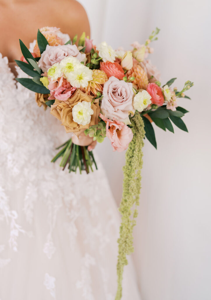 Bride and groom sharing romantic wedding portraits at Horseshoe Bay Resort surrounded by sunshine and stunning Lake LBJ scenery.