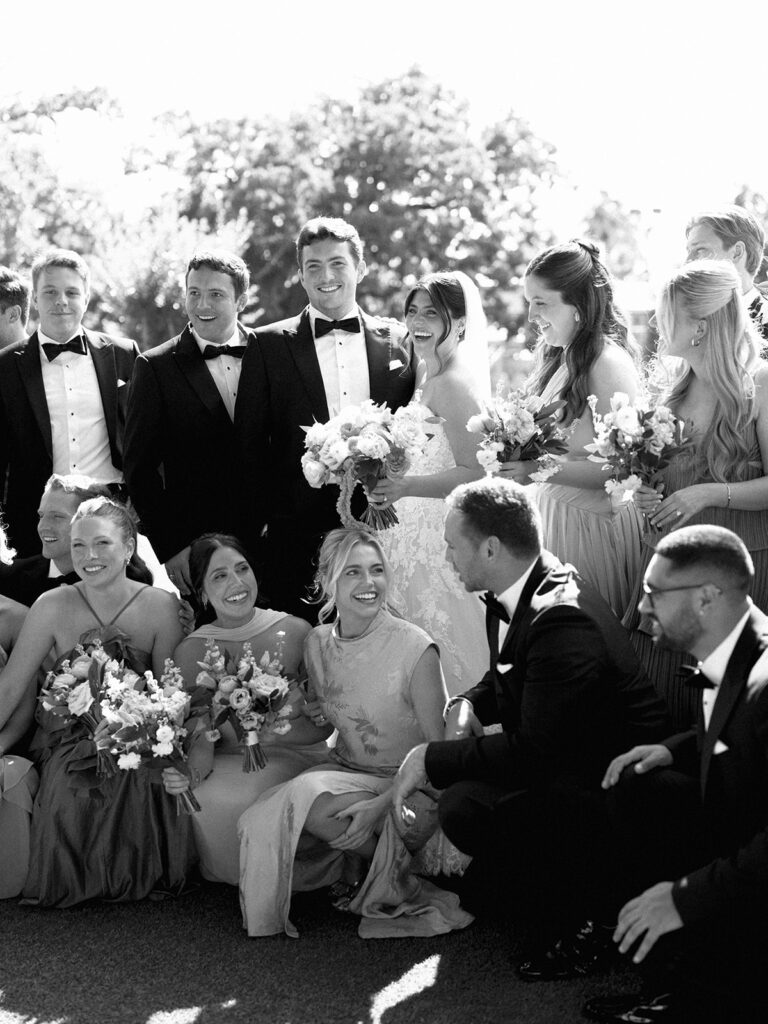 Bride and groom sharing romantic wedding portraits at Horseshoe Bay Resort surrounded by sunshine and stunning Lake LBJ scenery.