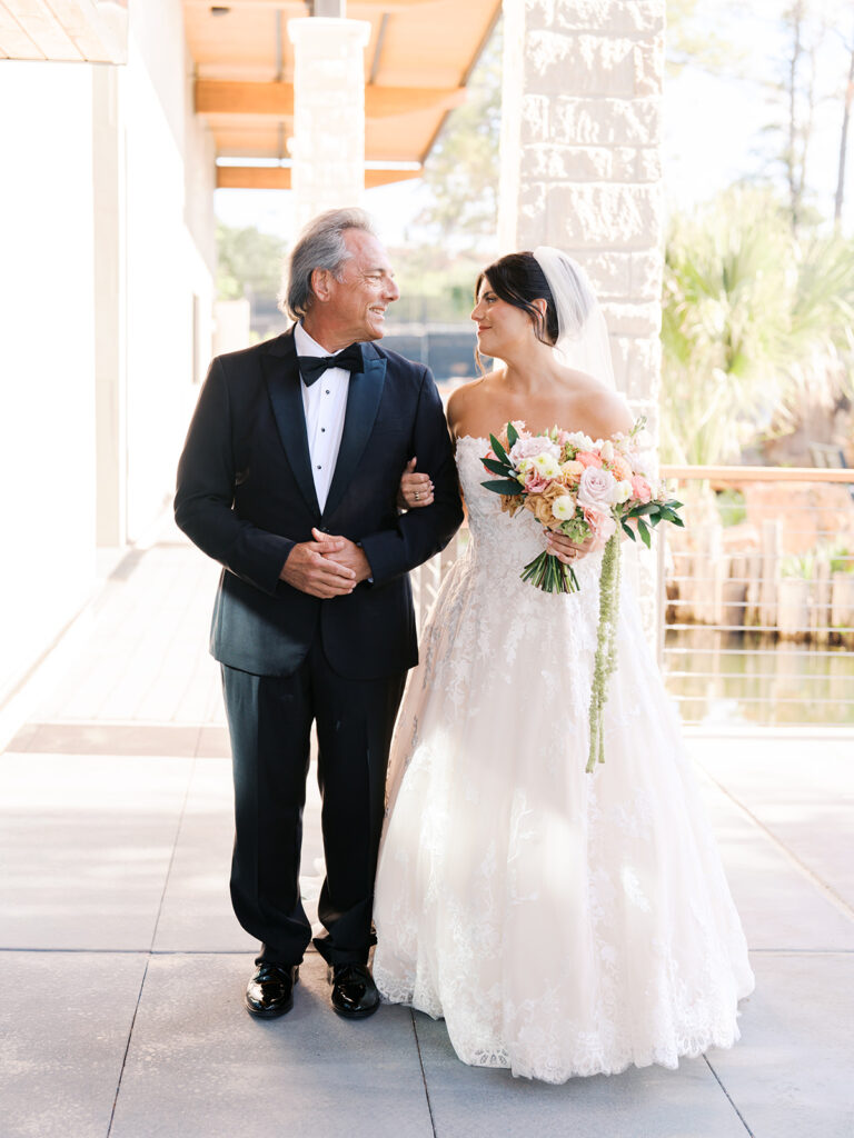 Bride and groom exchanging vows during an outdoor Horseshoe Bay Resort wedding ceremony with beautiful Texas waterfront views
