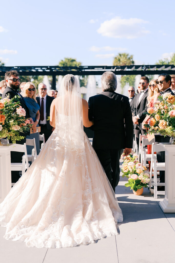 Bride and groom exchanging vows during an outdoor Horseshoe Bay Resort wedding ceremony with beautiful Texas waterfront views