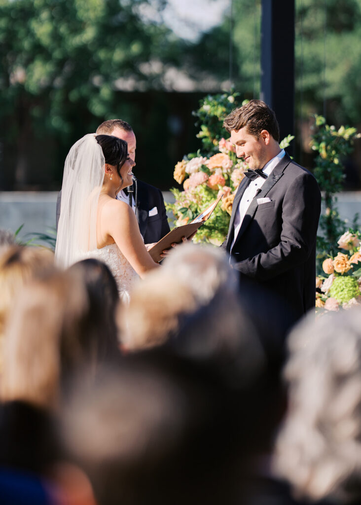 Bride and groom exchanging vows during an outdoor Horseshoe Bay Resort wedding ceremony with beautiful Texas waterfront views