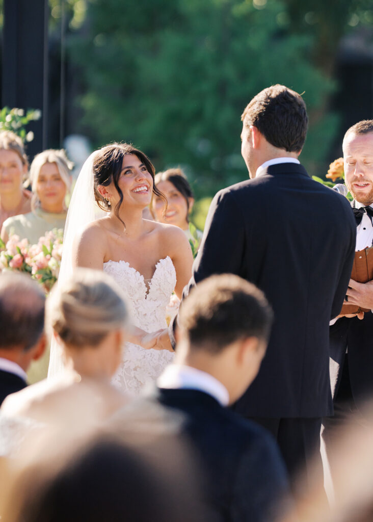 Bride and groom exchanging vows during an outdoor Horseshoe Bay Resort wedding ceremony with beautiful Texas waterfront views