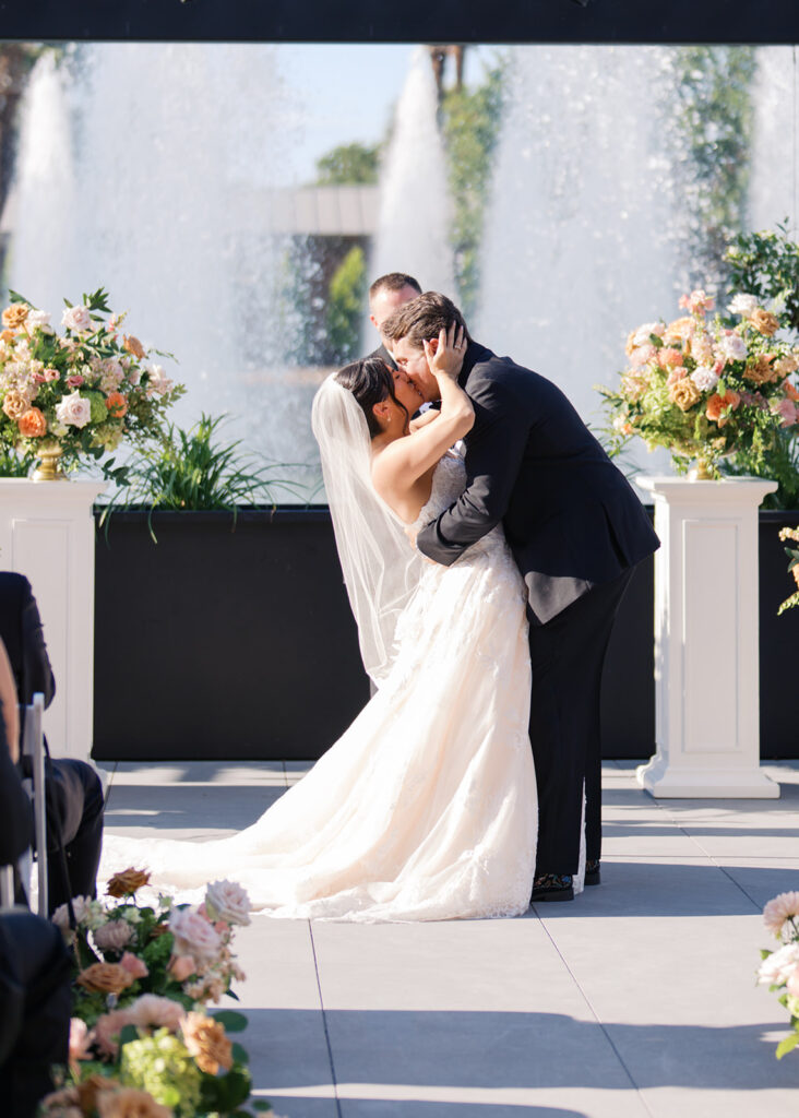 Bride and groom exchanging vows during an outdoor Horseshoe Bay Resort wedding ceremony with beautiful Texas waterfront views